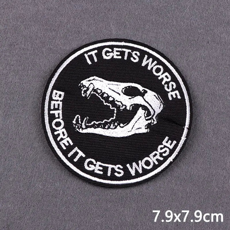 Black embroidered patch with white text IT GETS WORSE BEFORE IT GETS WORSE and a skull design