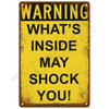 A vintage yellow metal warning sign with black text that reads WARNING WHAT'S INSIDE MAY SHOCK YOU!