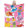 A pink flannel throw blanket featuring a cartoon design of Elmo and Friends characters.