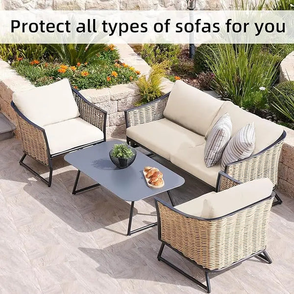 Outdoor wicker sofa set with light beige cushions and a glass table in a garden setting