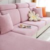 A pink polar fleece jacquard sofa seat cushion cover with matching pillows and a decorative flower cushion.