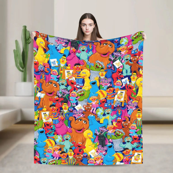 A colorful flannel throw blanket featuring characters from Sesame Street including Elmo and Friends