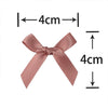 A pink satin ribbon bow shown with dimension lines indicating a 4cm size.