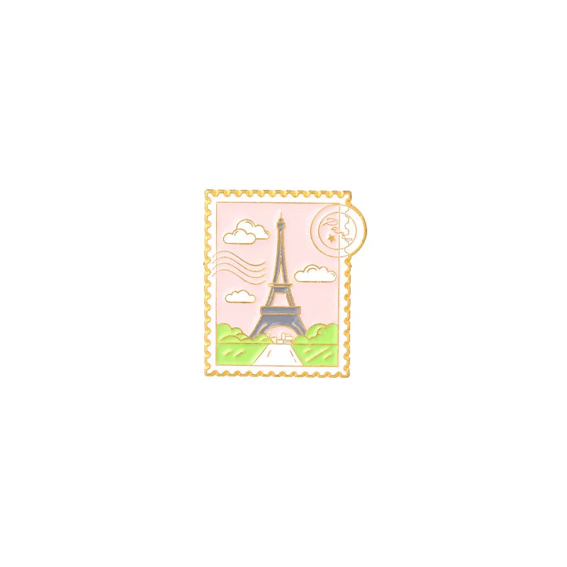 Vintage enamel airline ticket lapel pin featuring the Eiffel Tower and a moon.