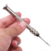 A hand holds a silver leather sewing awl kit with interchangeable needles and a sharp point.