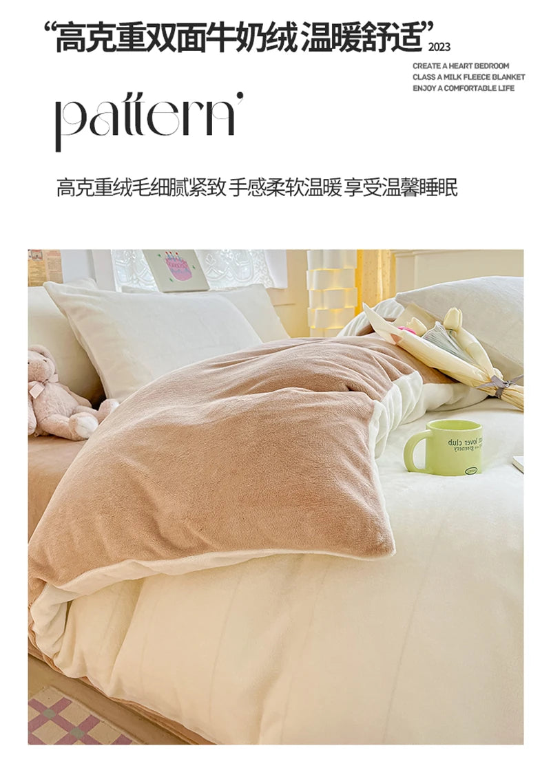 A soft, light beige velvet blanket is draped over a white duvet cover in a bedroom setting.