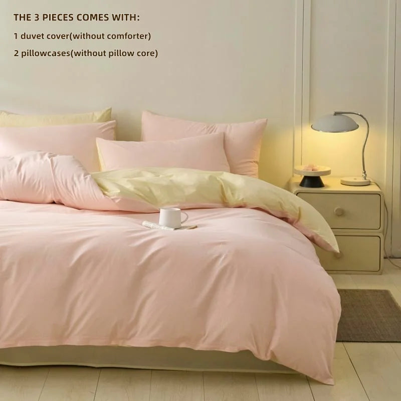 A pink duvet cover set with three pieces including a duvet cover, two pillowcases, and a pillow core.