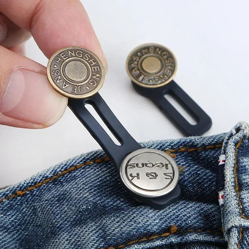 A close-up of a brass button with the name jeans hengsheng attached to a black extender for denim clothing.