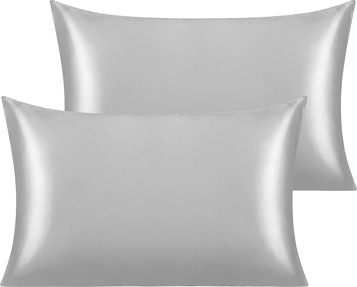 A pair of smooth, silver-gray silky satin toddler pillowcases.