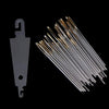 A set of gold eye embroidery and hand sewing needles arranged diagonally against a black background.