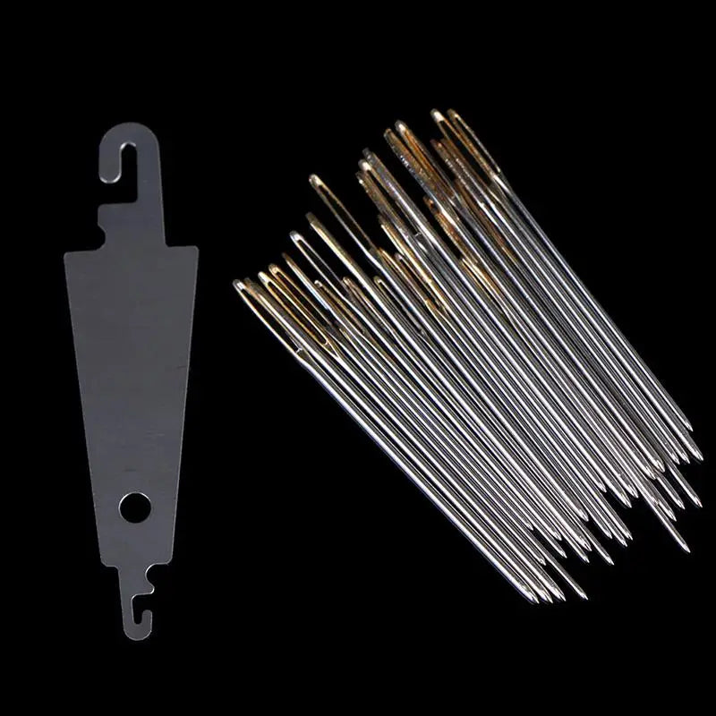A set of gold eye embroidery and hand sewing needles arranged diagonally against a black background.