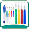 A set of colorful seam ripper and thread cutter tools displayed vertically in a green frame.