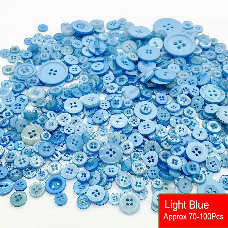 A pile of assorted light blue resin sewing buttons for crafting and DIY projects
