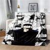 A black and white graphic throw blanket featuring Jujutsu Kaisen anime characters and scenes.
