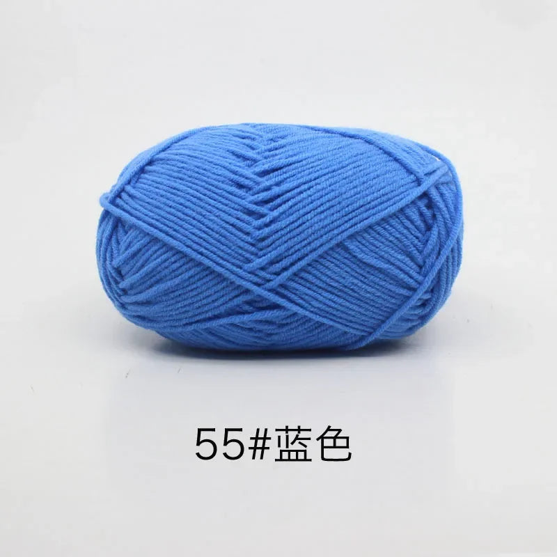 A ball of bright blue organic cotton 4ply knitting yarn for crafts.