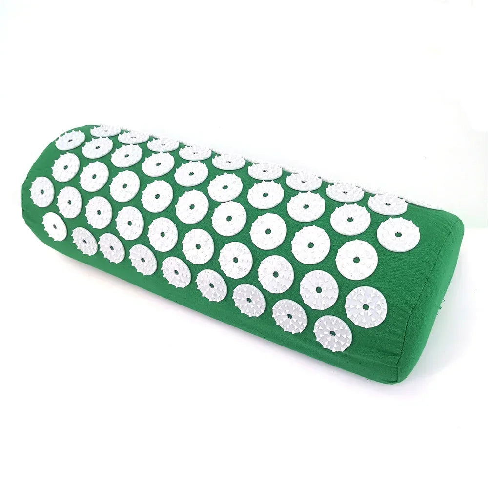 Green acupressure relief mat and pillow set covered in white discs for pain and stress relief