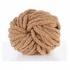 A ball of hand-woven chunky chenille yarn in a light tan or beige color.