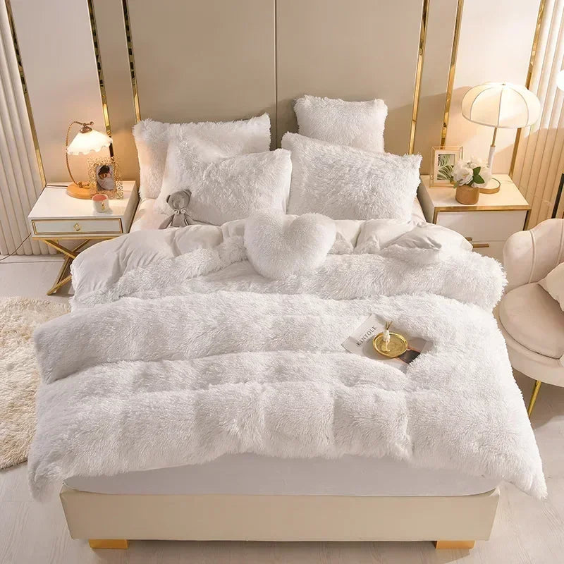 A luxurious white plush mink velvet duvet set displayed on a bed with matching pillows and elegant bedside tables.