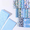 A collection of floral cotton fabric strips in various patterns and colors for quilting and crafting.