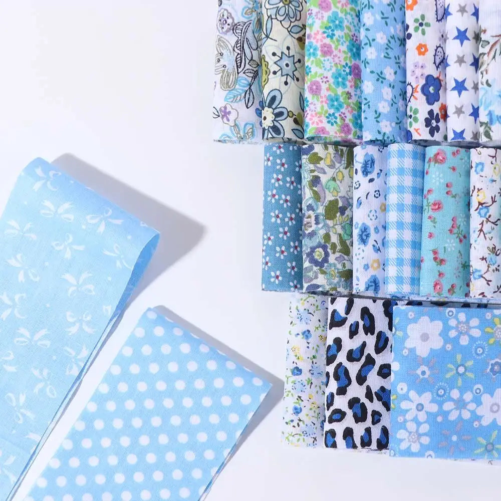 A collection of floral cotton fabric strips in various patterns and colors for quilting and crafting.