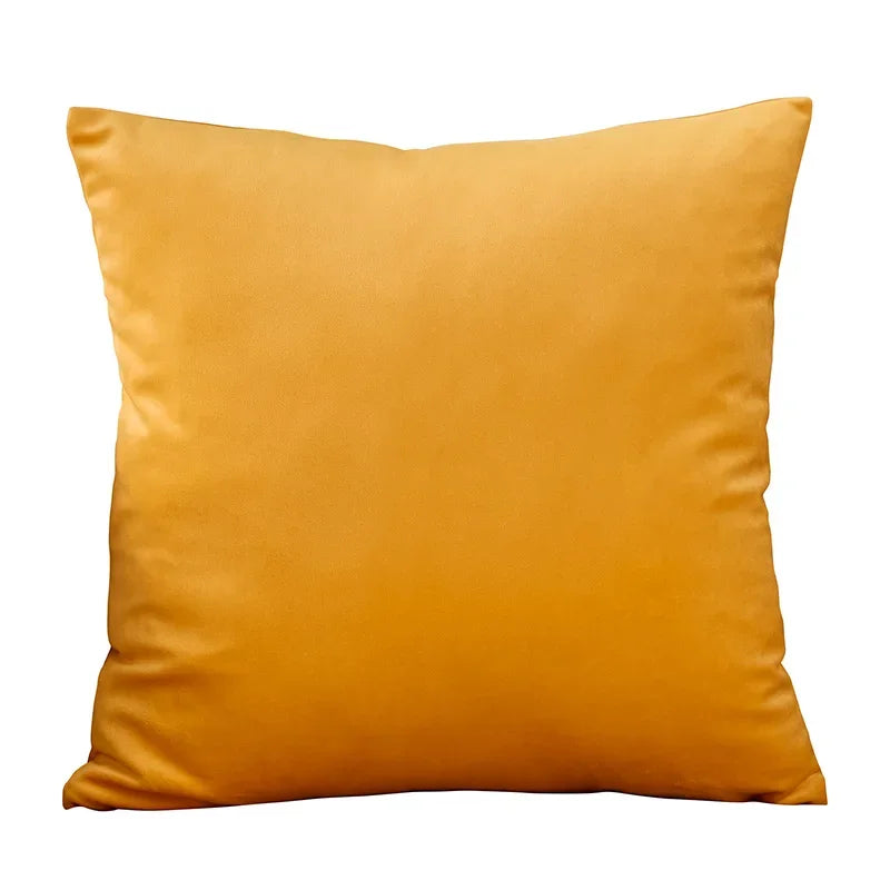 A square velvet throw pillow cover in a rich golden yellow color.