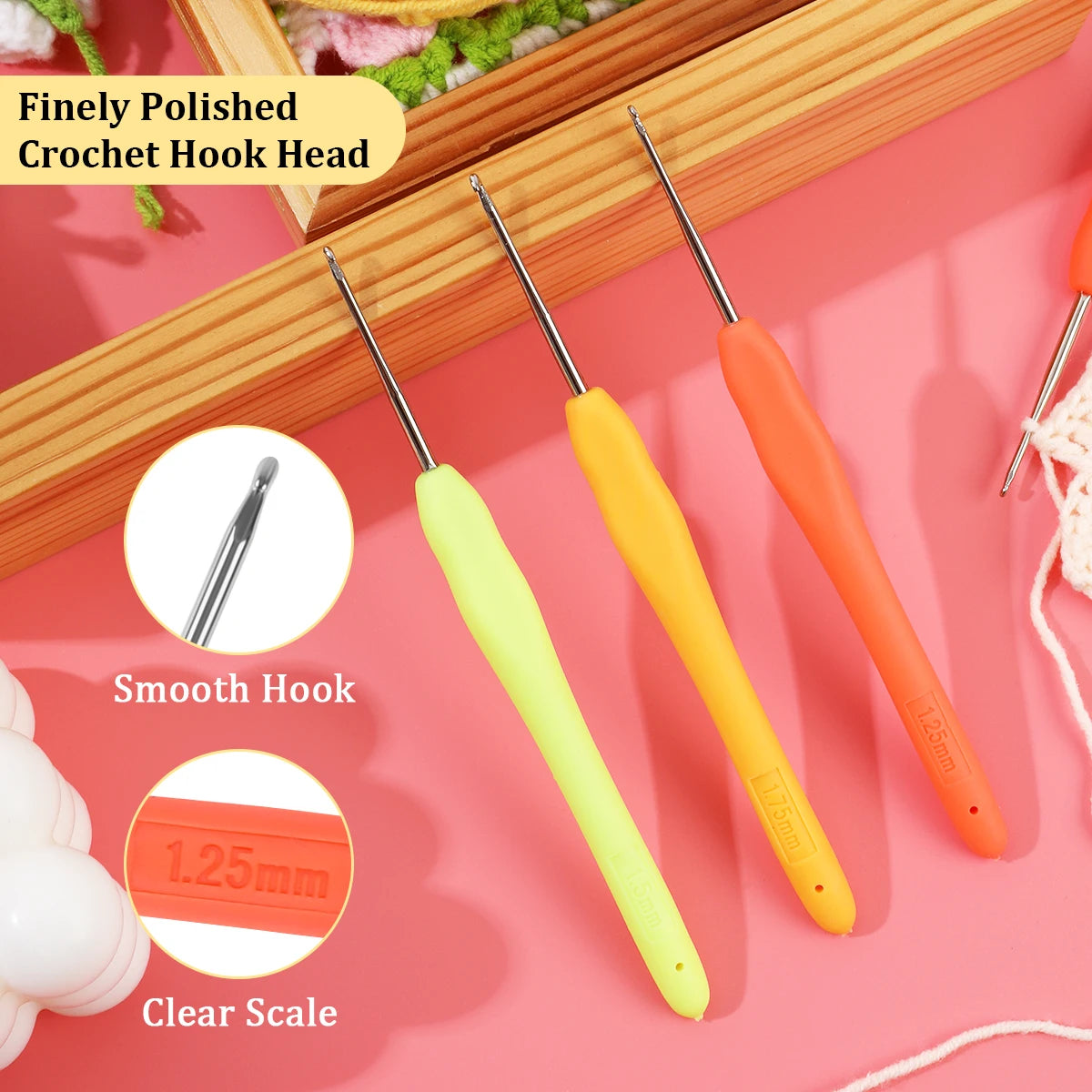 A set of finely polished yellow and orange crochet hooks with a clear scale showing 1.25mm size.