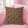 A decorative pillow cover featuring an orange and black leopard print on a pink sofa.