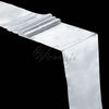 A white satin table runner draped elegantly, showing soft folds and luxurious texture.
