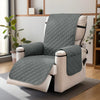 A gray washable recliner sofa slipcover with a white frame and anti-slip strap is shown on a floor.