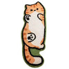 A plush rug shaped like an orange and white cartoon cat