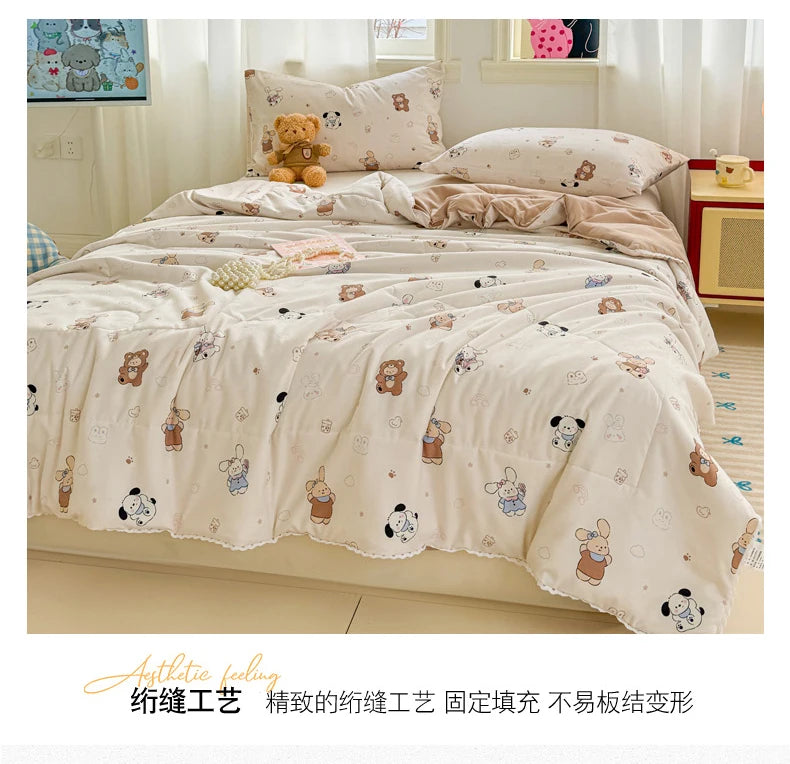 A beige quilted blanket with a floral pattern is displayed on a bed, featuring soft fabric and decorative pillows.