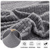 Close-up of a thick gray jacquard sofa cover fabric showing texture and comfort features.