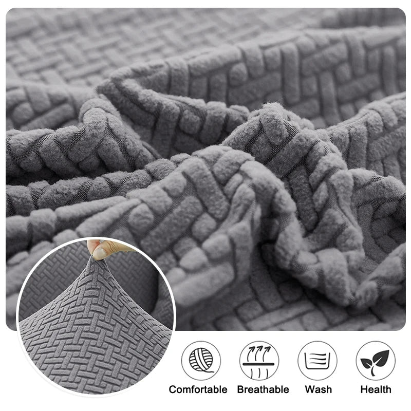 Close-up of a thick gray jacquard sofa cover fabric showing texture and comfort features.