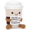 A handmade plush pocket doll with light beige skin and brown clothing, smiling.