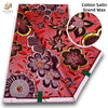 Red and maroon cotton satin grand wax print fabric with floral patterns