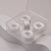 A clear plastic container holds four spools of prewound sewing machine bobbin threads.