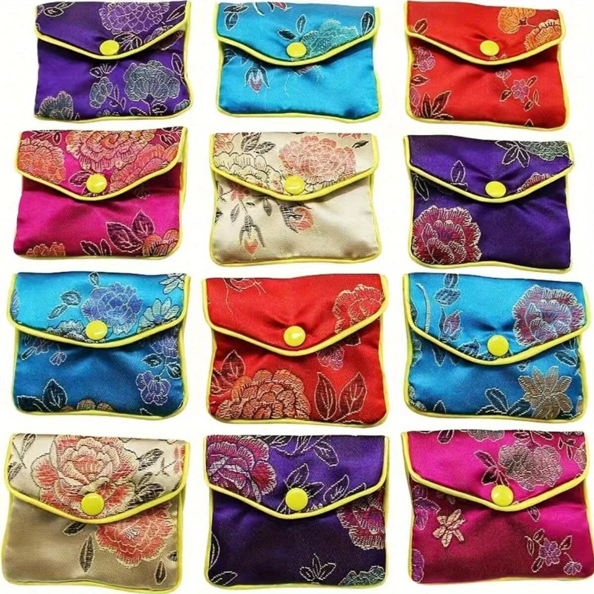 A collection of multi-color silk brocade jewelry pouches in various floral patterns and colors.