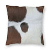 A square cushion cover featuring a brown and white cowhide print with a hidden zipper.