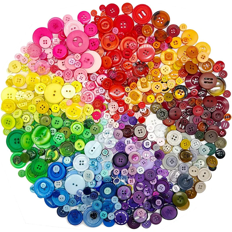 A large pile of assorted resin sewing buttons in various colors including pink, red, yellow, green, and purple.