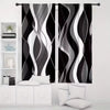A set of two abstract wavy line curtains in black and white featuring light-filtering rod pocket panels.