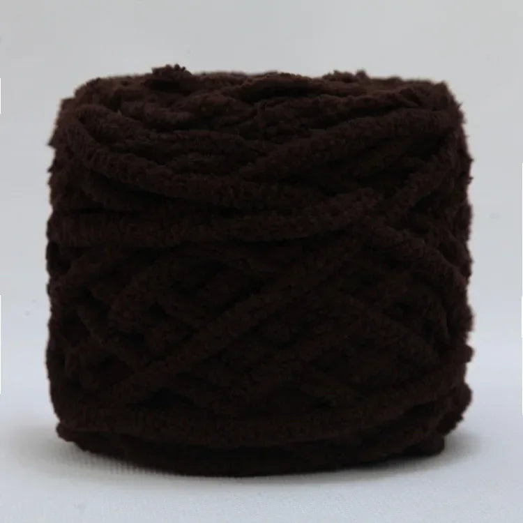 A ball of dark brown chenille knitting yarn used for hand crafting.