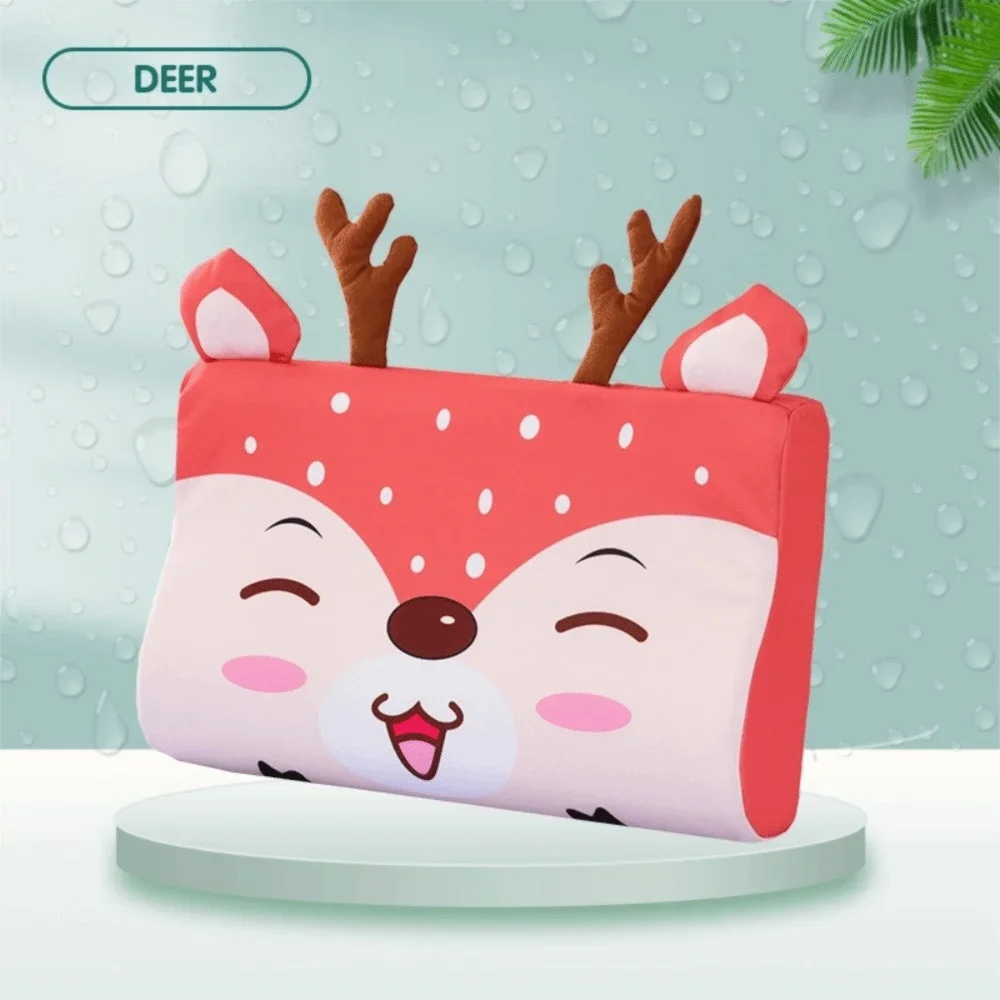 A pink fox-themed memory foam neck pillow with brown antlers is displayed against a light green background.