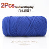 A skein of bright blue elastic yarn used for crafting and display.