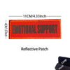 An orange reflective patch embroidered with the text EMOTIONAL SUPPORT
