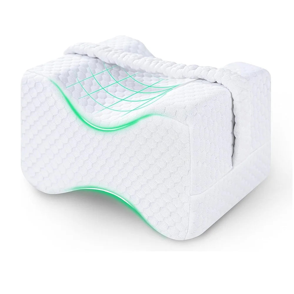 White memory foam knee pillow for side sleepers with adjustable straps, showing a green contoured design.