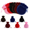 A set of ten velvet drawstring gift bags in various colors including pink, red, black, and blue.