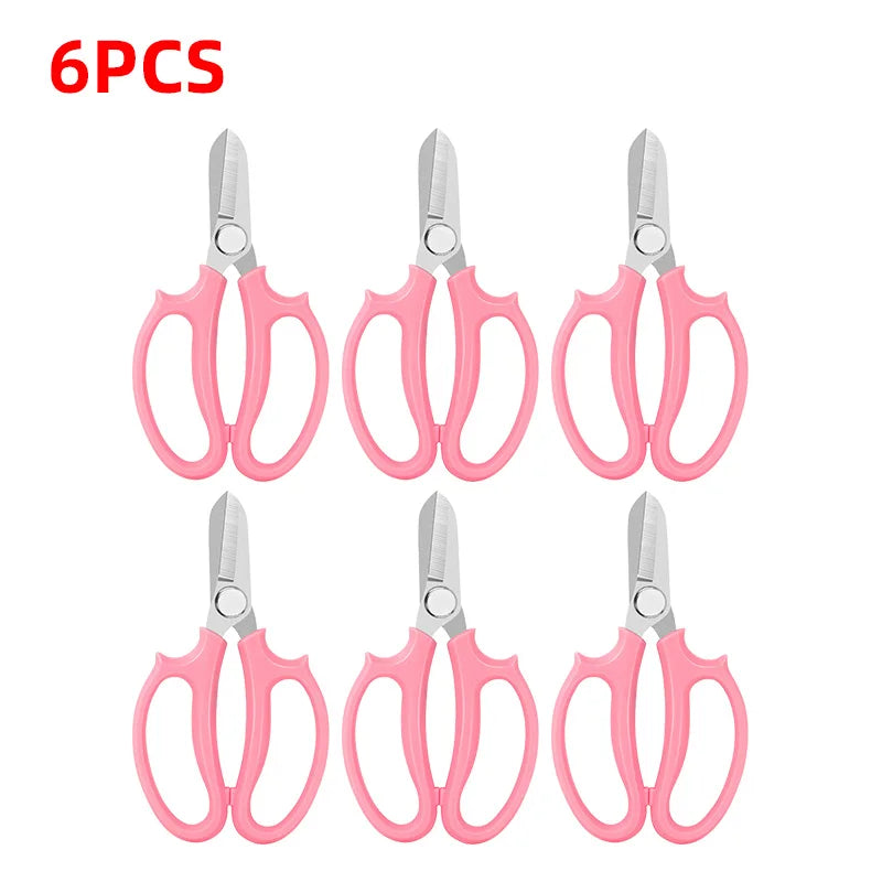 Six pairs of pink precision shears for bonsai and floral work with a comfort grip.