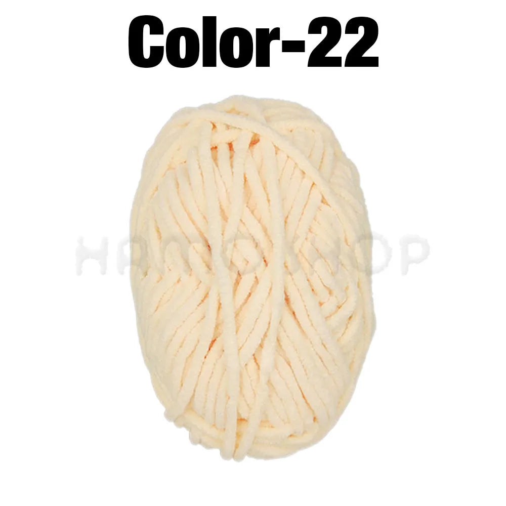 A ball of light peach colored Soft Velvet Chenille yarn labeled Color-22.