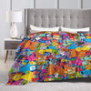 A colorful flannel throw blanket featuring various Sesame Street characters like Elmo and Friends.