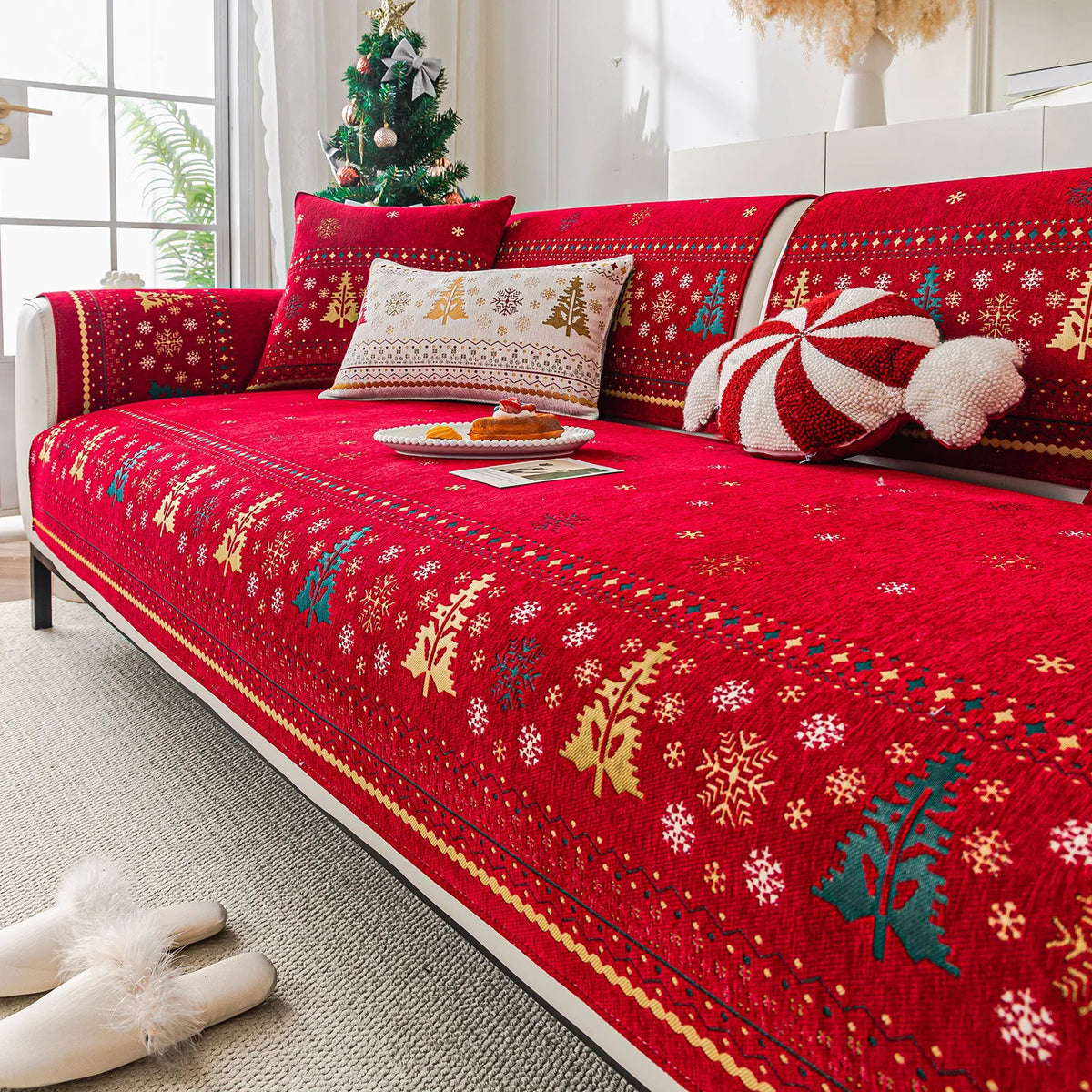 A vibrant red sofa seat cover featuring a white and gold Nordic pattern with evergreen motifs.